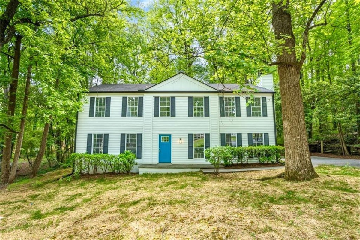 Same Stone Mountain house after full renovation by Mighty Estates, fresh paint and new landscaping